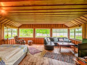 a room with a bed and a couch in a room at Bungalow Prütz in Fleeth +22 photos