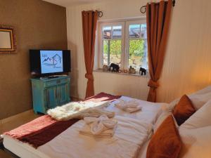 Postel nebo postele na pokoji v ubytování Eifel Dream KleineNims