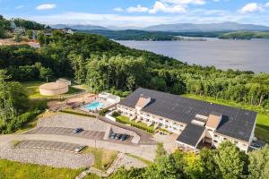 an aerial view of a house with solar panels on it at Amazing Lake Winni Views in Cedar Lodge Complex in Laconia