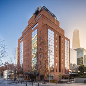 a tall brick building with a lot of windows at Four Points by Sheraton Santiago in Santiago