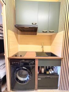 Kuchyň nebo kuchyňský kout v ubytování Studio familial, chaleureux, pied des pistes, 5e étage, côté calme