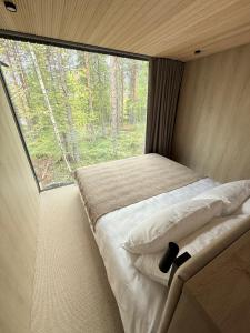 Ένα ή περισσότερα κρεβάτια σε δωμάτιο στο Noa Villas Adults Only Riverside Resort