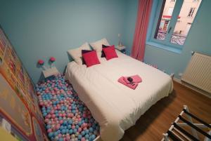 Ένα ή περισσότερα κρεβάτια σε δωμάτιο στο Le Candy by Clem