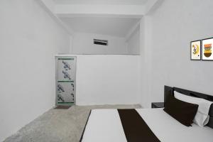 Ένα ή περισσότερα κρεβάτια σε δωμάτιο στο SPOT ON Hotel Veer Galaxy