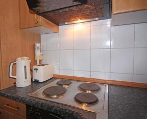 a stove top oven in a kitchen with a blender at Orth A5 in Orth