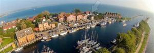 an aerial view of a harbor with boats in the water at Surf and Chill in Orth