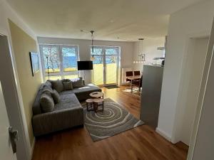 a living room with a couch and a table at Schöne Aussicht in Orth