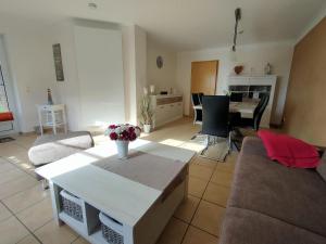 a living room with a couch and a table at Unsere Wenke in Wenkendorf auf Fehmarn
