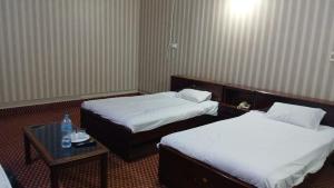 Postel nebo postele na pokoji v ubytování SSClub Hotel Peshawar