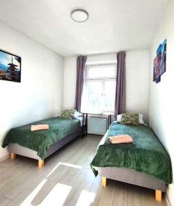 Postel nebo postele na pokoji v ubytování Ronus Apartments Łódź Pomorska 116 -Bezpłatny Parking