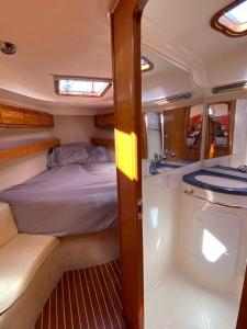 a bed and a sink in the back of a boat at Boat - Yoga and sailing retreat in Marigot