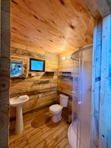 a bathroom with a toilet and a sink and a shower at Glamping Puertecillo Surf & Camp in Puertecillo