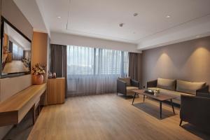 Un lugar para sentarse en Orange Hotel Beijing Yansha Landmark River