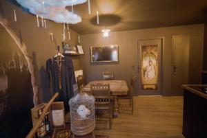 a room with a bed and a table and chairs at Le Nimbus by Clem in Pélussin