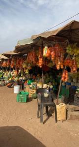 a market with a bunch of fruits and vegetables at Oka in Déni Diarke