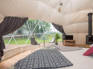 a bedroom with a bed in a tent at Gwenllian in Machynlleth