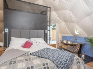 a bedroom with a bed in a tent at Gwenllian in Machynlleth +24 photos