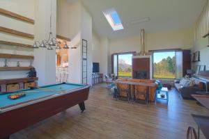 a living room with a pool table in it at Casona Alto Sarracin in Lloreda +34 photos