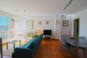 TV a/nebo společenská místnost v ubytování El Rincón del Puerto