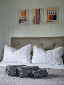 a bed with two towels on top of it at Maridalba 2 in La Coronilla +13 photos