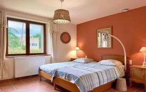 a bedroom with a bed and a window at Villa spacieuse avec piscine à Saint-Michel-d'Euzet in Saint-Michel-d'Euzet +41 photos