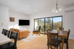 a living room with a table and a couch at Lake & Laughter Unit 1 in Rockaway Beach