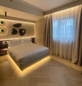 Ένα ή περισσότερα κρεβάτια σε δωμάτιο στο Hotel Trianon