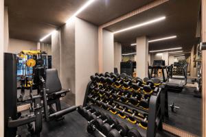 a gym with rows of chairs and weights at OZ Hotel Collection in Cartagena de Indias