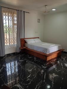 Ένα ή περισσότερα κρεβάτια σε δωμάτιο στο Studio Apartments Guest House