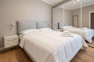 En eller flere senge i et værelse på Appartamento Panoramico 2-4 persone Metro Cornelia