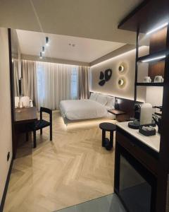 Ένα ή περισσότερα κρεβάτια σε δωμάτιο στο Hotel Trianon