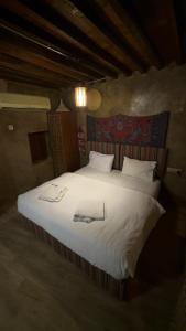 Ένα ή περισσότερα κρεβάτια σε δωμάτιο στο حياه العقر hayat alaqar +12 φωτογραφίες