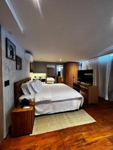 Postel nebo postele na pokoji v ubytování Duke Beach Hotel Maresias