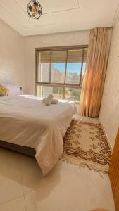 a bedroom with a large bed and a window at Imsouane Sea surf Camp in Imsouane