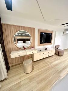 a bedroom with a large mirror and a bed at The diamond pyramids view inn in Cairo