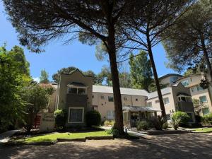 an exterior view of a building with trees at Carilo Princess in Carilo