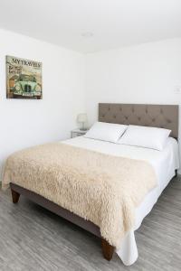 Postel nebo postele na pokoji v ubytování Hospedaje en Paine