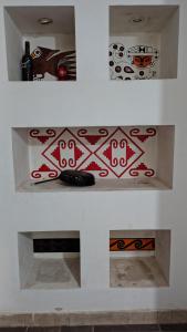 two views of a counter with a bottle of wine at Humadepto in Humahuaca