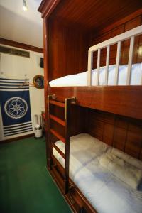 a couple of bunk beds in a boat at Appartement exception les pieds dans l'eau in Èze +31 photos