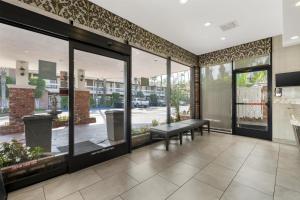 a store front with a bench and windows at Best Western Plus Carriage Inn in Sherman Oaks