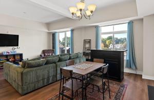 a living room with a couch and a table at Experience comfort at Quill Haven - Pet Friendly in Grand Haven