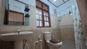 a bathroom with a sink and a toilet and a shower at Ceylon Bliss Retreat- Kandy Wellness Hotel in Kandy +44 photos