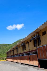 a building with a lot of windows and a blue sky at New Auto Motel in Barcelona
