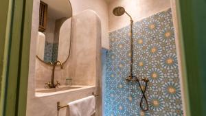 a bathroom with a shower and a sink at Riad Dar Tiflet in Marrakech +69 photos