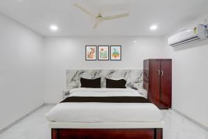 Ένα ή περισσότερα κρεβάτια σε δωμάτιο στο Hotel O Bluemoon