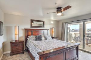 a bedroom with a bed and a balcony at Balcony and Grill Beachfront Lake Havasu City Condo in Lake Havasu City +23 photos