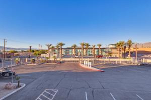 a parking lot with a skate park in front of a building at Balcony and Grill Beachfront Lake Havasu City Condo in Lake Havasu City