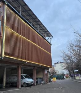 a building with a car parked in front of it at Hotel Kristali in Peshkopi +14 photos