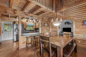 a dining room and kitchen with a table and chairs at The Great Bear Lodge in Vilas