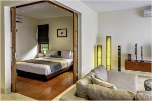 Postel nebo postele na pokoji v ubytování Karma Kandhara